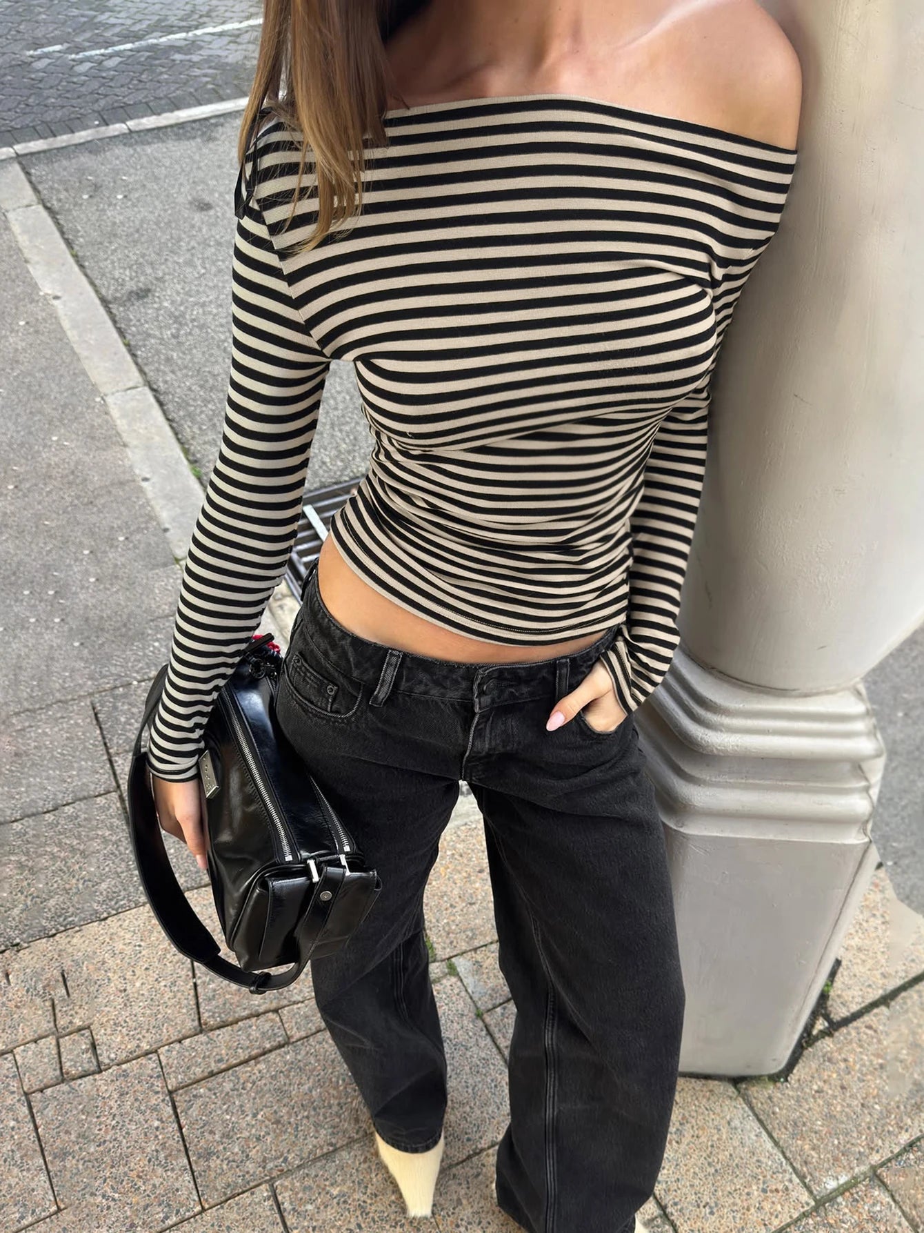 black and white stripped long sleeved off-shoulder top